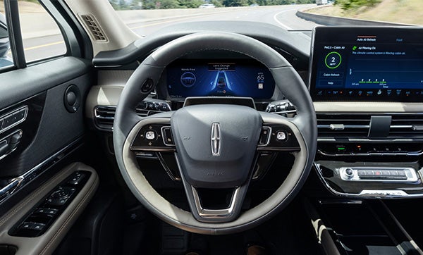 Steering wheel and information cluster of a Lincoln Vehicle while BlueCruise is operating