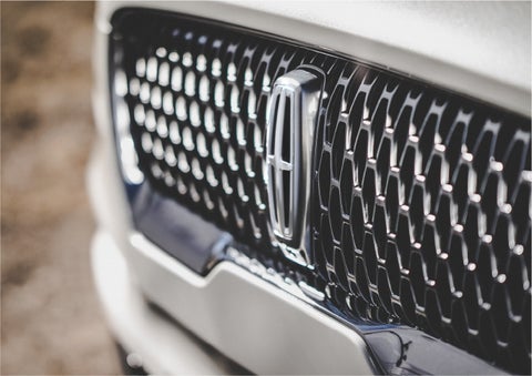 The grille of the 2023 Lincoln Aviator® Reserve model with an eye-catching repeated field of Lincoln Star logo shapes | Lincoln Demo 1 in Wooster OH