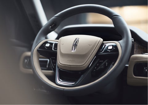 The intuitively placed controls of the steering wheel on a 2023 Lincoln Aviator® SUV | Lincoln Demo 1 in Wooster OH
