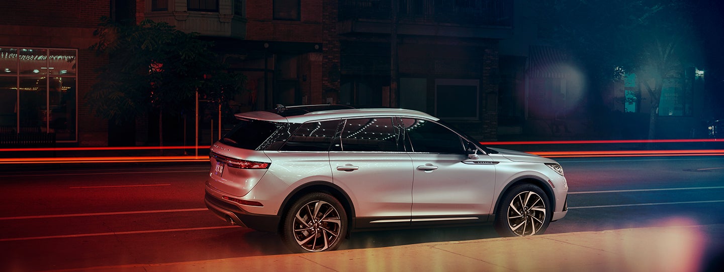 The 2024 Lincoln Corsair® SUV is parked on a city street at night. | Lincoln Demo 1 in Wooster OH