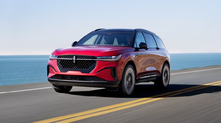 A 2024 Lincoln Nautilus® SUV is being driven on a seaside roadway. | Lincoln Demo 1 in Wooster OH